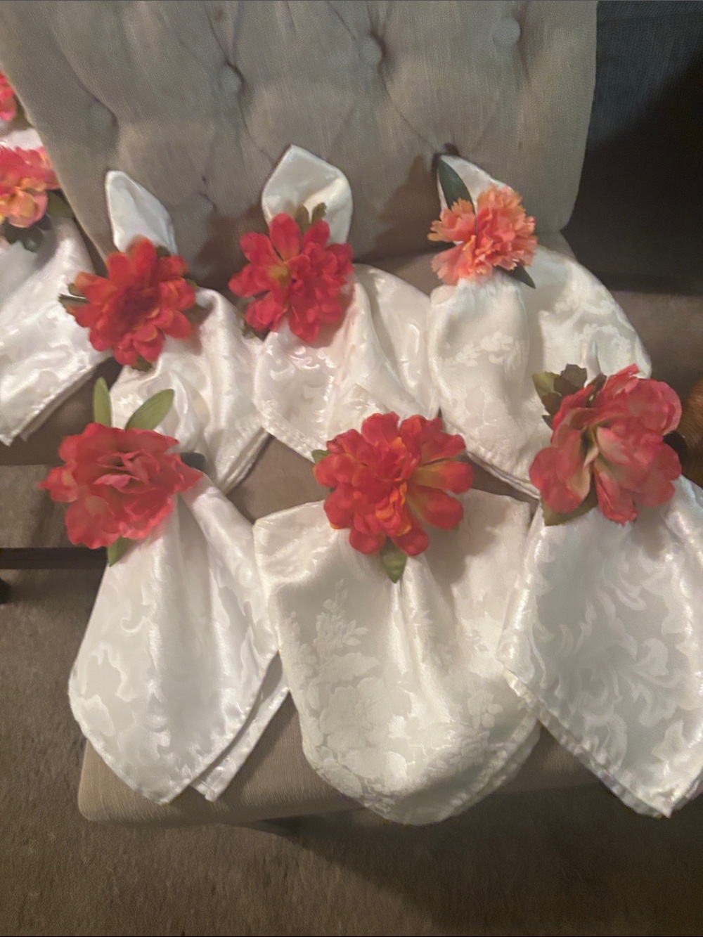 Six large easy care white napkins and 6  floral napkin rings.